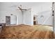 A living room featuring carpet floors and neutral walls and ceiling fan at 219 Caropine Dr., Surfside Beach, SC 29575