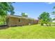 The backyard is spacious with green grass at 2415 Magnolia Lane, Little River, SC 29566