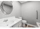 Cozy bathroom featuring a single sink vanity, toilet, and tub with shower at 2415 Magnolia Lane, Little River, SC 29566