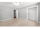 Bedroom featuring carpet, neutral walls, closet and entryway at 2415 Magnolia Lane, Little River, SC 29566