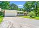 Well-maintained home featuring a brick exterior, attached garage, and a charming front porch area at 2415 Magnolia Lane, Little River, SC 29566
