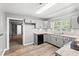 Charming kitchen features shaker cabinets, granite countertops, and stainless steel appliances at 2415 Magnolia Lane, Little River, SC 29566