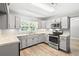 Beautiful kitchen with stainless steel appliances, shaker cabinets, and durable countertops at 2415 Magnolia Lane, Little River, SC 29566