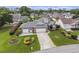 Brick home with manicured landscaping, three-car garage, and a long driveway in a quiet neighborhood at 2479 Glen Dr., Little River, SC 29566