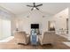 Bright living room with high ceilings, wood floors, comfortable seating, and natural light streaming in at 2479 Glen Dr., Little River, SC 29566