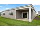 A covered back patio with a ceiling fan, perfect for enjoying the outdoors at 2859 Riverboat Way, Conway, SC 29526