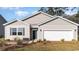 Charming single-story home featuring a two-car garage and well-maintained landscaping at 2859 Riverboat Way, Conway, SC 29526