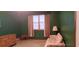 This living room features a window with curtains, a floral sofa, wooden dresser, and a lamp on a table at 289 Whites Creek Rd., Georgetown, SC 29440