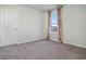 Bright bedroom features neutral walls, plush carpeting, and a window with decorative curtains at 292 Clear Lake Dr., Conway, SC 29526