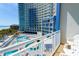 Balcony view overlooking the resort pool and ocean at 304 N Ocean Blvd. # 1113, North Myrtle Beach, SC 29582