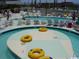 Relaxing lazy river pool with colorful tubes, a perfect spot for soaking up the sun and unwinding at 304 N Ocean Blvd. # 1113, North Myrtle Beach, SC 29582