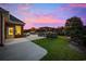 Expansive backyard with a lush lawn, an outdoor kitchen, and a pool, ideal for outdoor entertaining at 310 Babylon Pine Dr., Myrtle Beach, SC 29579