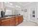 The primary bathroom features a double sink vanity, granite countertops, and a glass-enclosed shower at 310 Babylon Pine Dr., Myrtle Beach, SC 29579