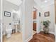 Well-lit powder room features a pedestal sink, elegant fixtures, and neutral color palette, offering a clean and stylish space at 310 Babylon Pine Dr., Myrtle Beach, SC 29579