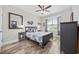 Cozy bedroom with a modern ceiling fan, a full bed, and a large window with natural light at 310 Babylon Pine Dr., Myrtle Beach, SC 29579