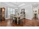 This dining room features hardwood floors, natural light, and elegant chair rail, creating an inviting space for meals at 310 Babylon Pine Dr., Myrtle Beach, SC 29579