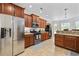 Well-equipped kitchen featuring stainless steel appliances, granite countertops, ample wood cabinets, and a wine fridge at 310 Babylon Pine Dr., Myrtle Beach, SC 29579