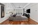 Open-concept living room showcasing hardwood floors, a tray ceiling, and a cozy seating area with backyard access at 310 Babylon Pine Dr., Myrtle Beach, SC 29579