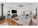 Spacious living room with hardwood floors, tray ceiling, and a comfortable sofa, and a unique popcorn maker at 310 Babylon Pine Dr., Myrtle Beach, SC 29579
