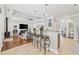 Open-concept living space with granite countertops, pendant lighting, bar seating, and seamless flow to the cozy living area at 310 Babylon Pine Dr., Myrtle Beach, SC 29579