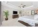 Comfortable main bedroom boasts a tray ceiling, ceiling fan, and a tranquil ambiance for relaxation and rest at 310 Babylon Pine Dr., Myrtle Beach, SC 29579
