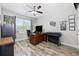 Home office with a ceiling fan, dark wood desk, and a bright window with natural light at 310 Babylon Pine Dr., Myrtle Beach, SC 29579