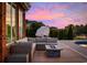 Back patio with comfortable seating, a fire pit, and views of the pool at 310 Babylon Pine Dr., Myrtle Beach, SC 29579
