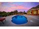 Backyard oasis featuring a stunning pool, complemented by an outdoor kitchen and scenic water views at 310 Babylon Pine Dr., Myrtle Beach, SC 29579