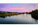 Picturesque water view featuring a serene lake with a fountain, surrounded by beautifully landscaped homes at dusk at 310 Babylon Pine Dr., Myrtle Beach, SC 29579