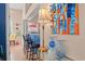 Stylish bar area with bar stools and colorful artwork creates a welcoming space at 314 Lyons Cove Dr., Myrtle Beach, SC 29577