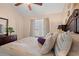 Comfortable bedroom with an accent wall, stylish decor, and lots of light at 314 Lyons Cove Dr., Myrtle Beach, SC 29577