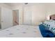 Bedroom featuring a colorful bedding set with doors to an additional room and closet at 314 Lyons Cove Dr., Myrtle Beach, SC 29577