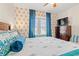 Bedroom featuring a unique wallpaper with an accent window and dark curtains and matching décor at 314 Lyons Cove Dr., Myrtle Beach, SC 29577