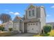 Well-kept two-story home featuring an attached garage and landscaped front garden at 314 Lyons Cove Dr., Myrtle Beach, SC 29577