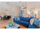 Stylish living room with blue sofa, hardwood floors, and dining area in the background, perfect for gatherings at 314 Lyons Cove Dr., Myrtle Beach, SC 29577