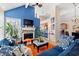 Inviting living room with fireplace, blue accent wall, and stylish furnishings leading into the kitchen at 314 Lyons Cove Dr., Myrtle Beach, SC 29577