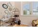 Cozy home office with lots of clocks, natural light, and shelving at 314 Lyons Cove Dr., Myrtle Beach, SC 29577