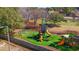 Community playground featuring swings, slides, and climbing structures on a green artificial surface at 314 Lyons Cove Dr., Myrtle Beach, SC 29577