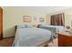 Bright bedroom featuring two cozy beds, coastal decor and neutral-toned walls for a relaxing retreat at 3211 S Ocean Blvd. # 204, Myrtle Beach, SC 29577