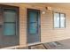 Exterior front door and entrance to unit with covered walkway and door mats at 3211 S Ocean Blvd. # 204, Myrtle Beach, SC 29577