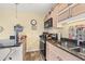 Kitchenette boasts granite countertops, stainless steel appliances, and neutral wood cabinets at 3211 S Ocean Blvd. # 204, Myrtle Beach, SC 29577