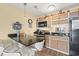Kitchenette features granite countertops, stainless steel appliances, and seating at the bar at 3211 S Ocean Blvd. # 204, Myrtle Beach, SC 29577