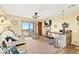 Cozy living room boasts a beach view from the sliding glass doors and a small dining area with bar seating at 3211 S Ocean Blvd. # 204, Myrtle Beach, SC 29577