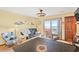 Living room features a cozy seating area with balcony access and views at 3211 S Ocean Blvd. # 204, Myrtle Beach, SC 29577