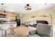 Living room and kitchenette provides a cozy sitting area with a futon and additional seating options at 3211 S Ocean Blvd. # 204, Myrtle Beach, SC 29577