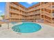 Community pool with views of multi-story condominium buildings at 3211 S Ocean Blvd. # 204, Myrtle Beach, SC 29577