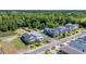 Aerial view of a neighborhood with manicured lawns, beautiful homes, and tree-lined streets showcases community appeal at 338 St. Julian Ln., Myrtle Beach, SC 29579