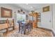 Cozy dining area featuring a wooden table, comfortable chairs, and a large window for natural light at 338 St. Julian Ln., Myrtle Beach, SC 29579
