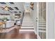 Foyer with staircase and hardwood floors that opens to the living room and coffered ceiling at 338 St. Julian Ln., Myrtle Beach, SC 29579