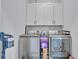 Functional laundry room with modern washer and dryer units, ample storage cabinets at 338 St. Julian Ln., Myrtle Beach, SC 29579